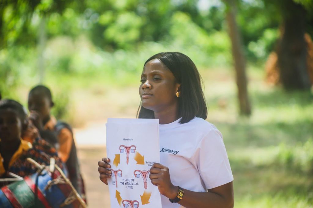 Lady with menstrual hygiene awareness inscriptions